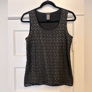 Ann Taylor black tank with beige underlay in front.
